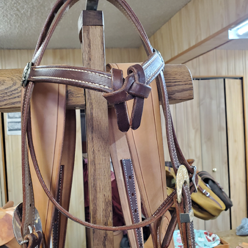 Custom California knot headstall with barbwire silver concho and silver buckles